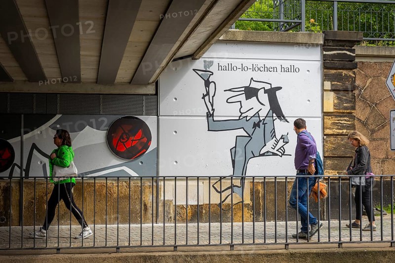 Two visions of the city of Radebeul have been realised in the spirit of Udo Lindenberg. The renovation and upgrading of Bahnhofstrasse in the Radebeul-West centre redevelopment area has been completed. Udo Lindenberg's mural Keine Panik (No Panic) and Burkhard Schade's tourist boards from the city's cultural advertising programme will welcome visitors to the city at Kötzschenbroda station, Radebeul, Saxony, Germany, Europe
