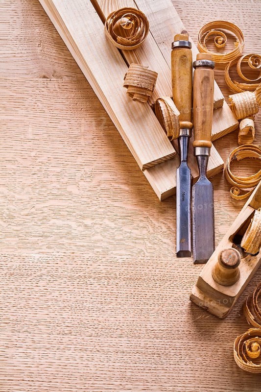 Organized copyspace carpentry chisels planks woodworkers plane on wooden board