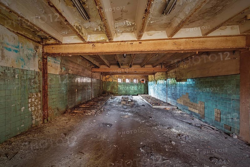Abandoned and dilapidated interior of a school with green tiles and ceiling beams, HF6, Lost Place, Seraing, Province of Liège, Belgium, Europe