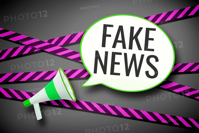 3D illustration of a megaphone and a speech bubble with the message fake