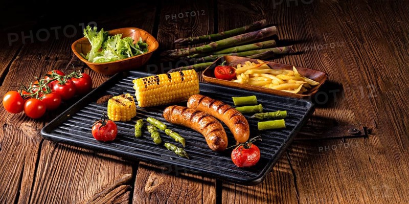 Grilled krakauer with french fries and green salad