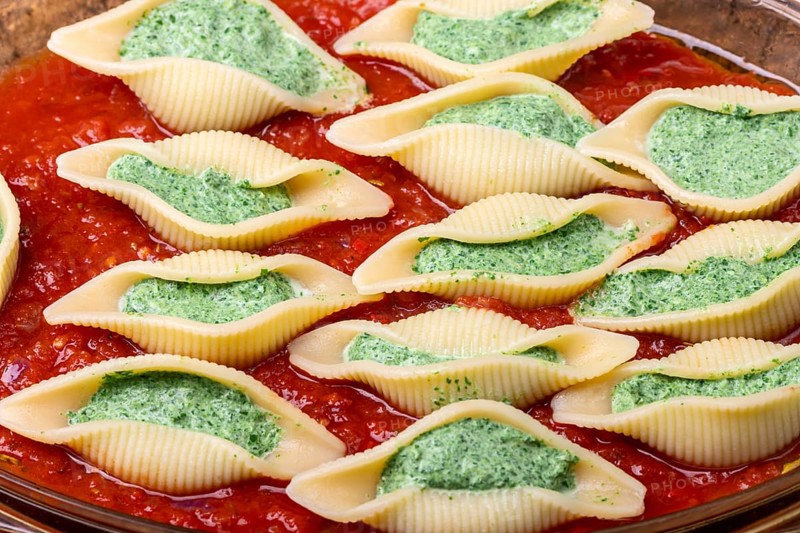 Italian conchiglino pasta filled with spinach