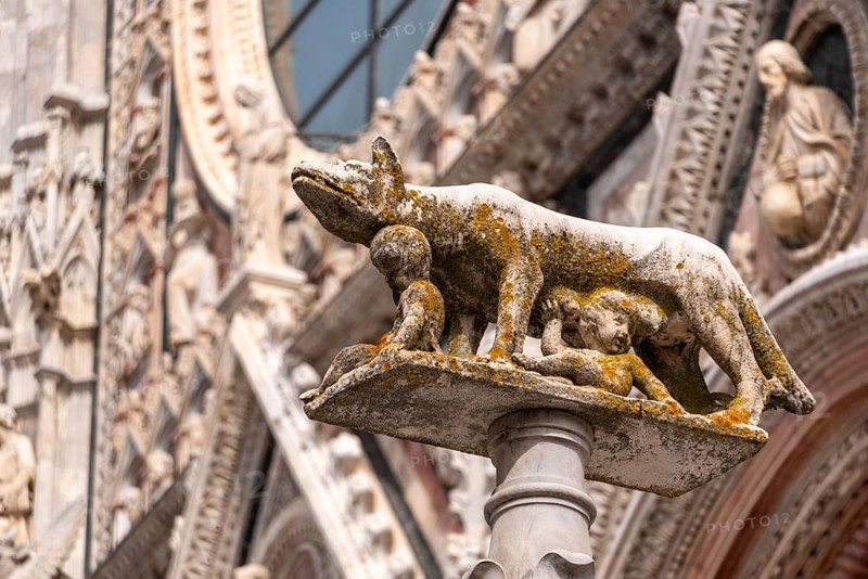 Statue of Romulus and Remus being fed by the wulf, at the central square of Siena, Italy, Europe