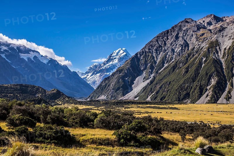 The concept of active, walking and photo tourism. The top of the mountain is covered with eternal snows. The highest mountain in New Zealand is Aoraki, or Mount Cook