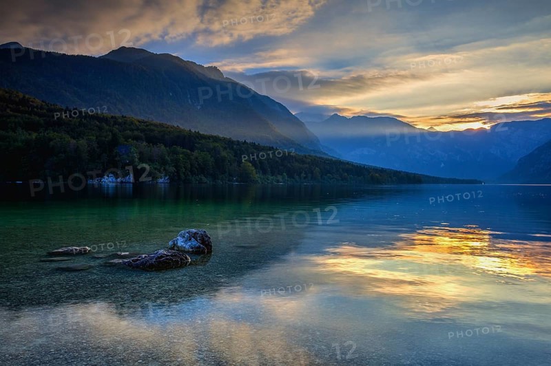 Dramatic sunset above the Bohinj Lake, Slovenia. It is located within the Bohinj Valley of the Julian Alps, in the northwestern Upper Carniola region, and part of Triglav National Park