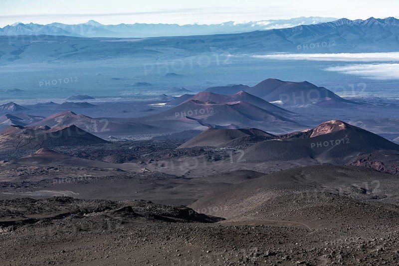 Beautiful volcano landscape of Kamchatka Peninsula: series of cinder cones and lava fields of fissure eruptions Plosky Tolbachik Volcano. Russian Far East, Kamchatka, Klyuchevskaya Group of Volcanoes