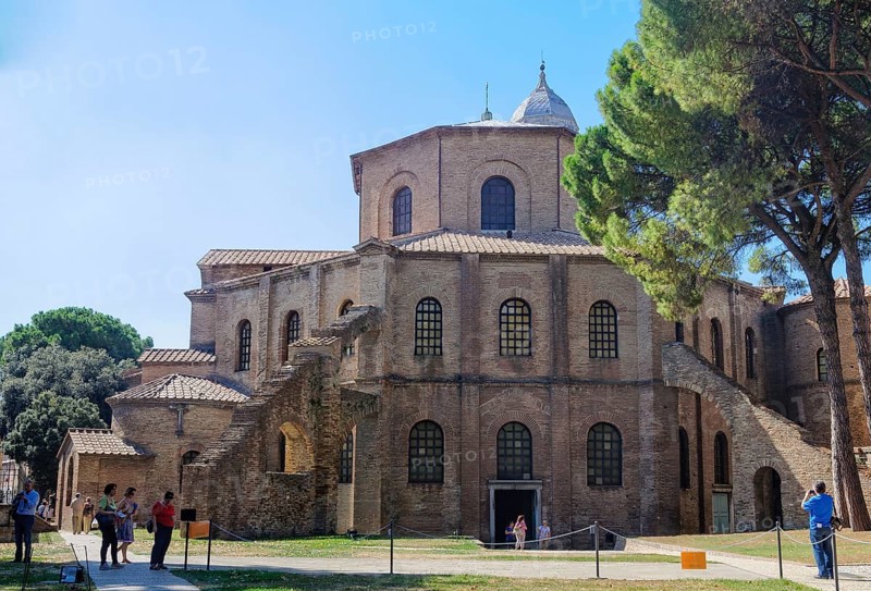Tourists admire a prime example of early Christian architecture, the octagonal Basilica of San Vitale, Ravenna, Italy, Europe