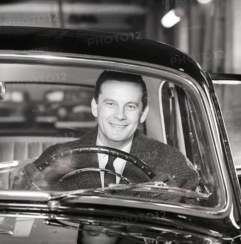 Driving in the 1960s. A man behind the steering wheel in his car looks happy. Sweden 1960. Kristoffersson ref CS93-10
