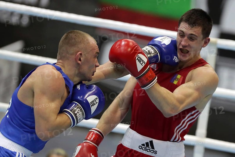 Sofia, Bulgaria - 26 February, 2021: Dmitri Galagot (red) of Moldova and Yevhenii Barabanov of Ukraine fight in their semifinal round of Welter (69kg) category of the 72-nd International Boxing Tournament Strandja 2021, Sofia, Bulgaria, Europe
