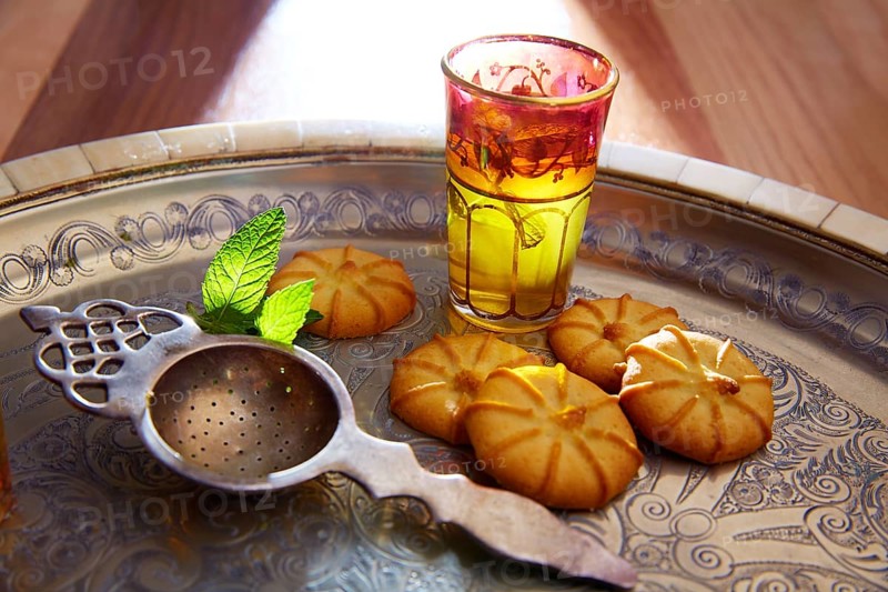 Green tea with mint Moroccan style on silver tray and biscuits