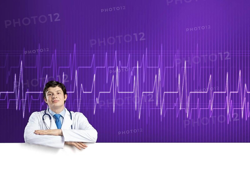 Young handsome doctor holding white blank banner. Place your text