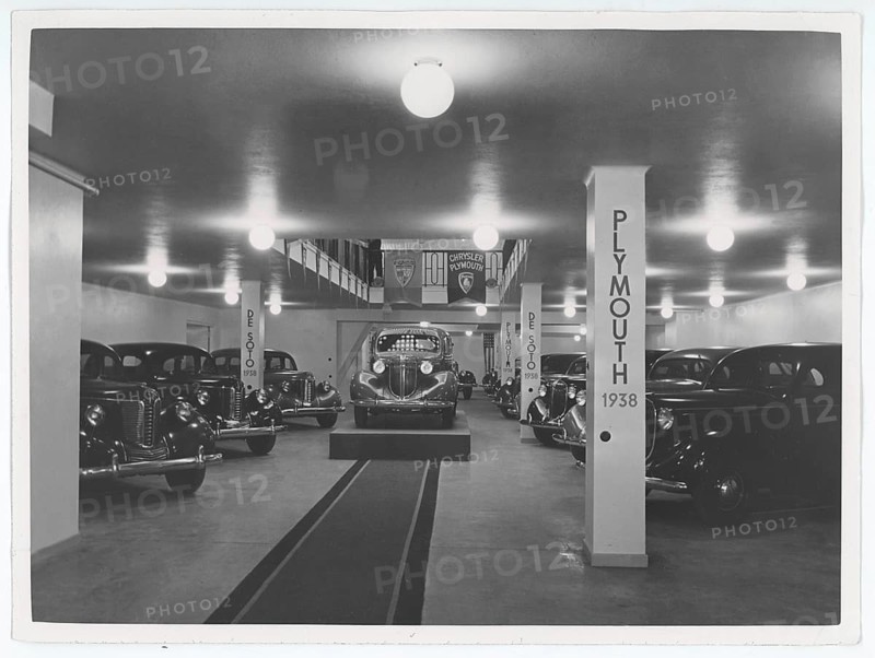 1930s new cars for sale. The swedish representative for General Motors have the brand new car models on display in their showroom. Plymouth, Chystler and De Soto. Sweden 1938