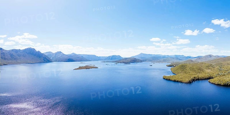Lake Burbury and surrounding mountain landscape on a warm summer's aftenoon near Queenstown in Tasmania, Australia, Oceania