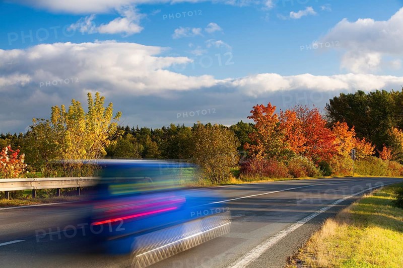 Speed car on a road in Krkonose mountain, Czech Republic, Europe
