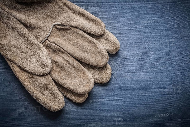 Working gloves on dark blue board