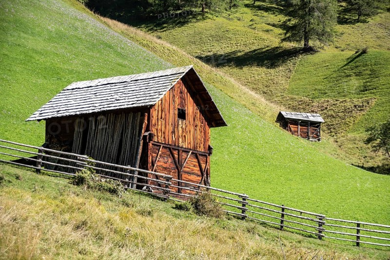 An old wooden hay shed in Val di Morins, the Dolomite Alps of South Tirol