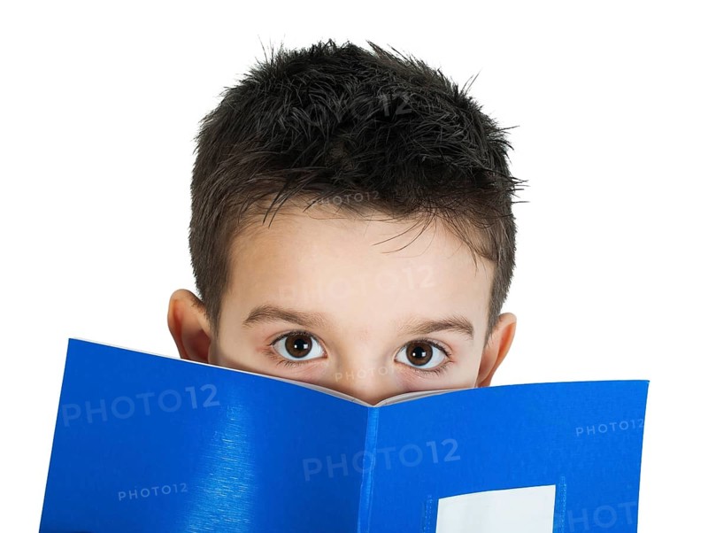 Child with notebook in front of the face. White isolated