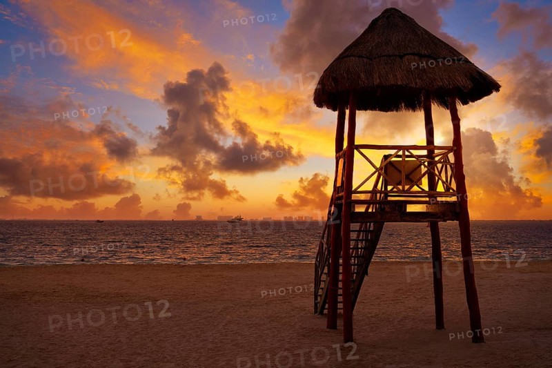 Isla Mujeres island Caribbean beach sunset baywatch tower Riviera Maya Mexico