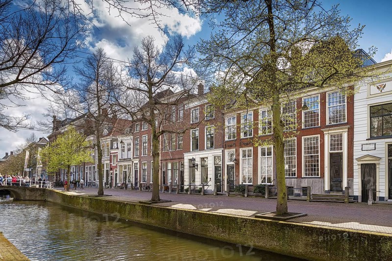 View of Delft canal with historic houses, Netherlands
