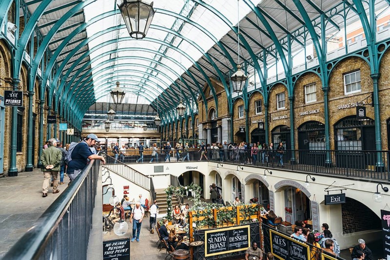 London, UK, May 15, 2019: Interior view of Covent Garden Market. Located in the West End of London, Covent Garden is renowned for its luxury fashion and beauty stores, restaurants and theatres