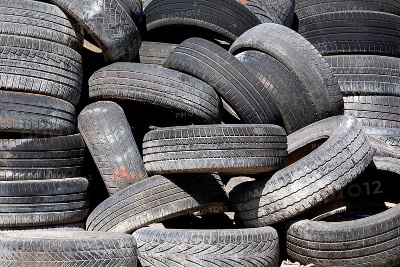 Old and used car tyres on a pile