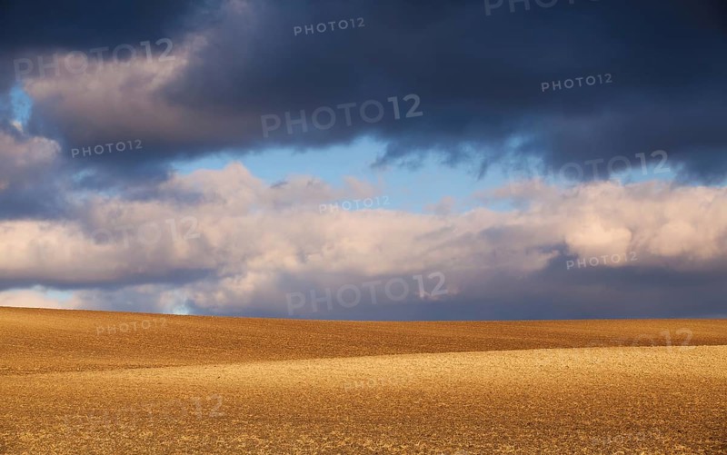 Sunset on the field ready for spring sowing