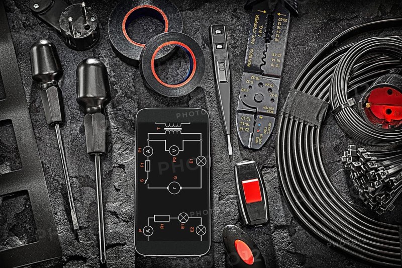 Big Black Electric Tools Set Smartphone Display With Blueprint On Abstract Stone Background