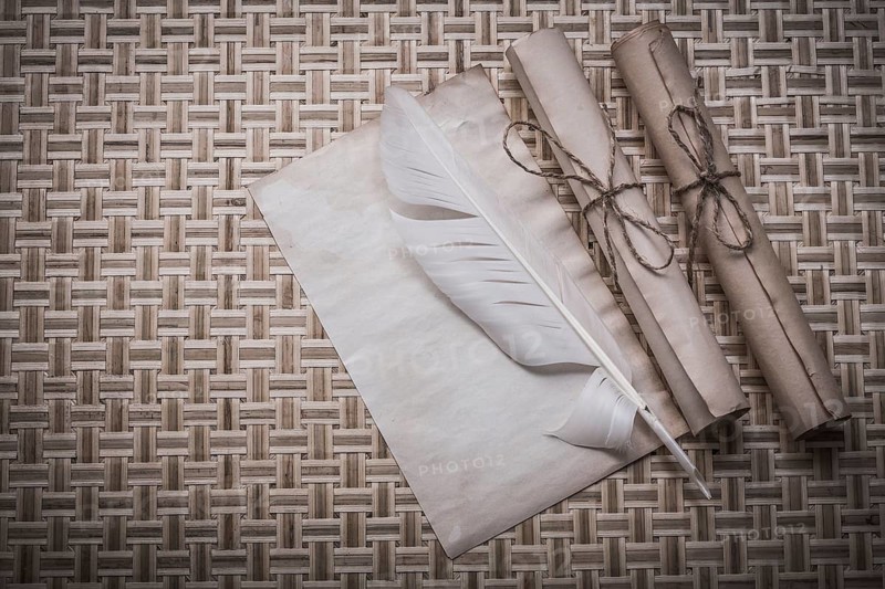Rolls of vintage paper clean sheet quill on woven matting