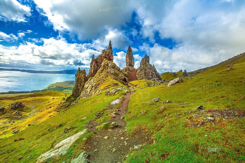 Old Man of Storr, large pinnacle of rock on top of a north hill in the isle of Skye, Highlands in Scotland, United Kingdom. The Old Man of Storr is one of the most photographed wonders in the world