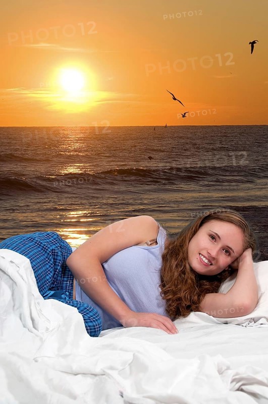 Beautiful young woman in bed at bedtime