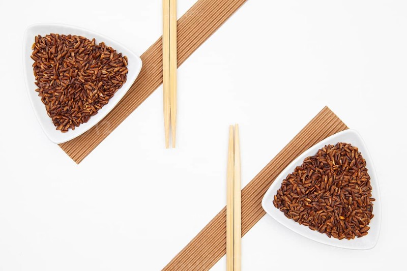 Top View Of White Sushi Plate With Rise And Chopsticks. Symmetry Food Design