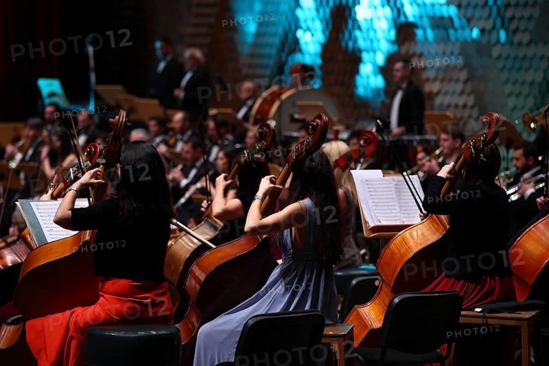An orchestra is a large instrumental ensemble typical of classical music, which combines instruments from different families