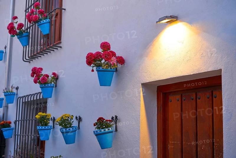 Flower pots in Granada Albaicin at sunset of Spain