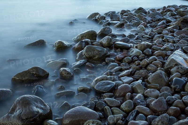 Time exposure of stones in the Westfjords coast, Iceland, Europe