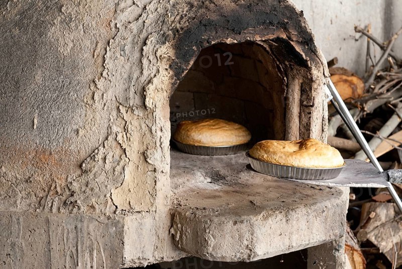 Fresh homemade bread cooked on a traditional clay oven. Home bakery