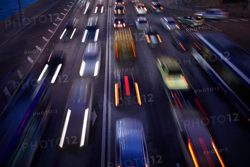 Car traffic at night. Motion blurred background. Long exposure shot
