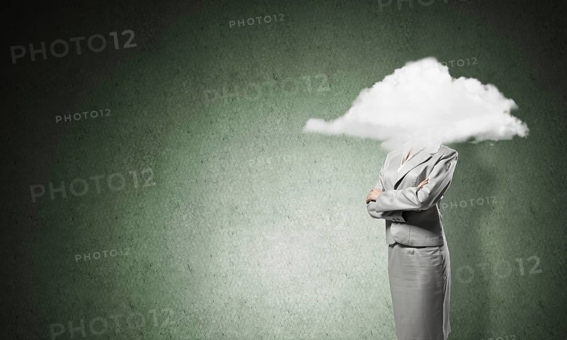 Businesswoman with arms crossed on chest and head in cloud