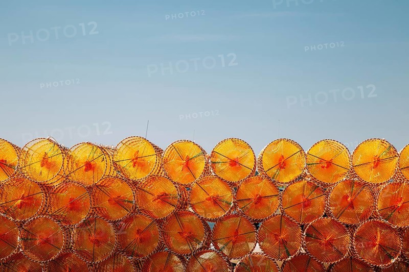 Stacked orange fishing trap net at BaeksaJang port in Anmyeondo Island, Taean, Korea