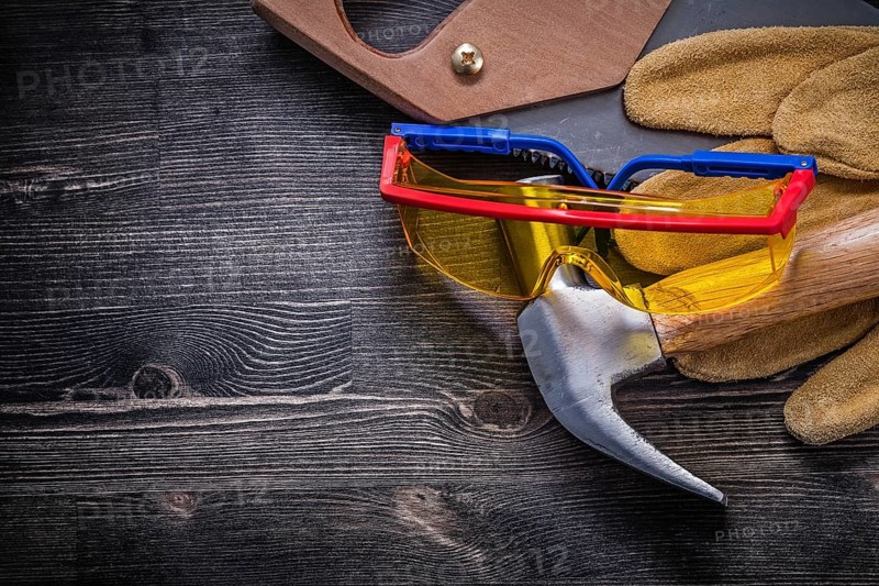 Hand saw claw hammer safety glasses leather gloves