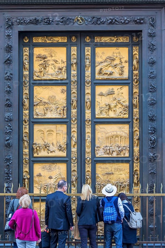 Tourists at the Gates of Paradise at the Baptistery of Saint John in Florence, Italy, Europe