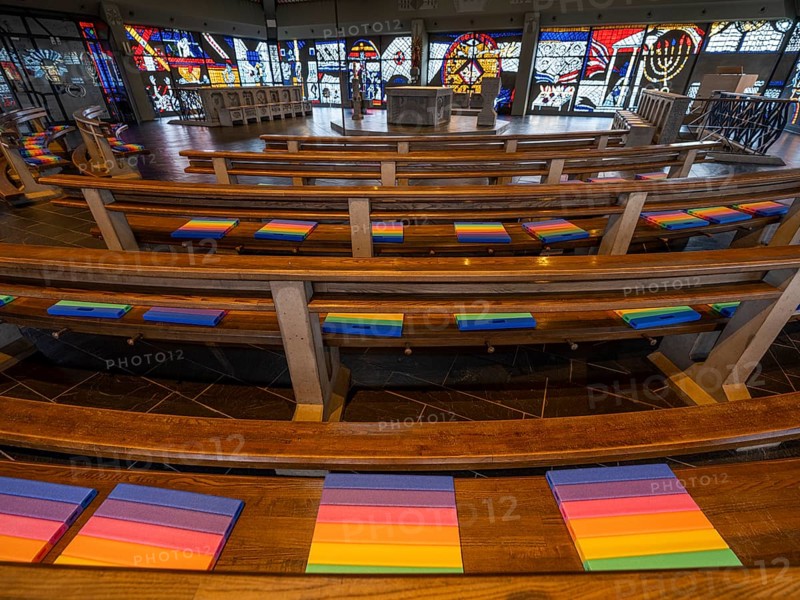 Catholic motorway church St. Christophorus on the A5 motorway near Baden Baden from 1978, interior, benches with rainbow-coloured seat cushions, Baden-Baden, Baden-Württemberg, Germany, Europe