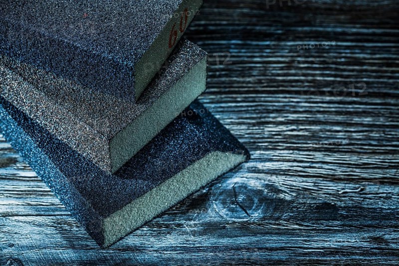 Sanding blocks on vintage wooden board top view