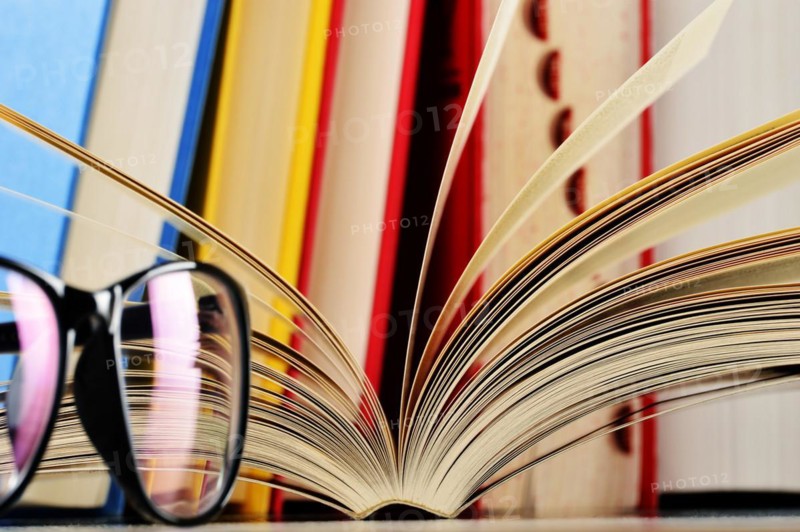 Composition with glasses and books on the table