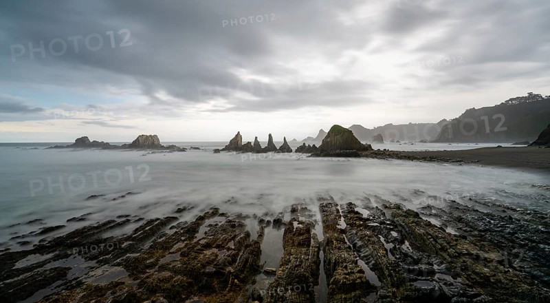 A long expiosure view of the Playa de Gueirua beach on the Costa Verde of Asturias