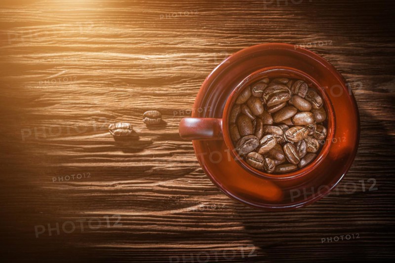 Coffee grain cup saucer on vintage wooden board