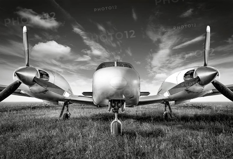 sports plane against a cloudy sky
