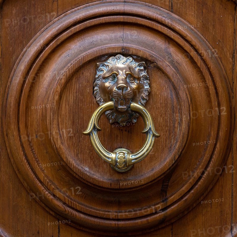Close up of rustic old door in Florence, Italy, Europe
