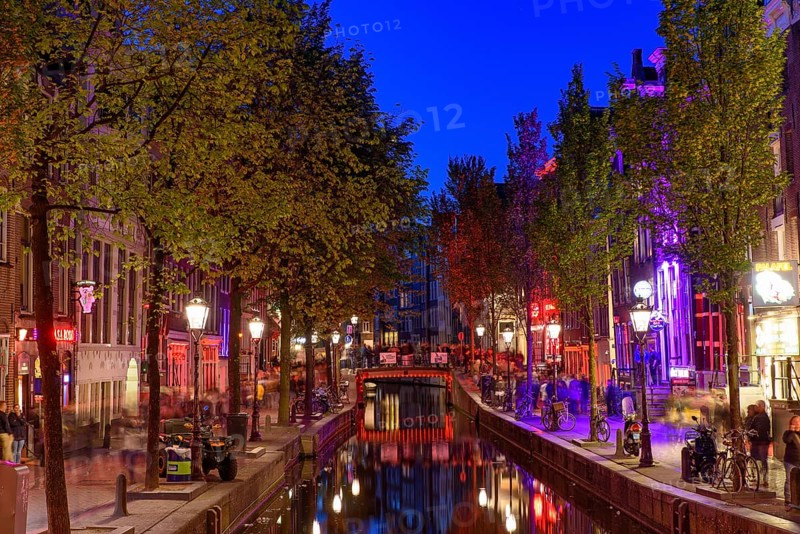 Night view of De Wallen, the famous red-light district with window prostitution in Amsterdam, Netherlands