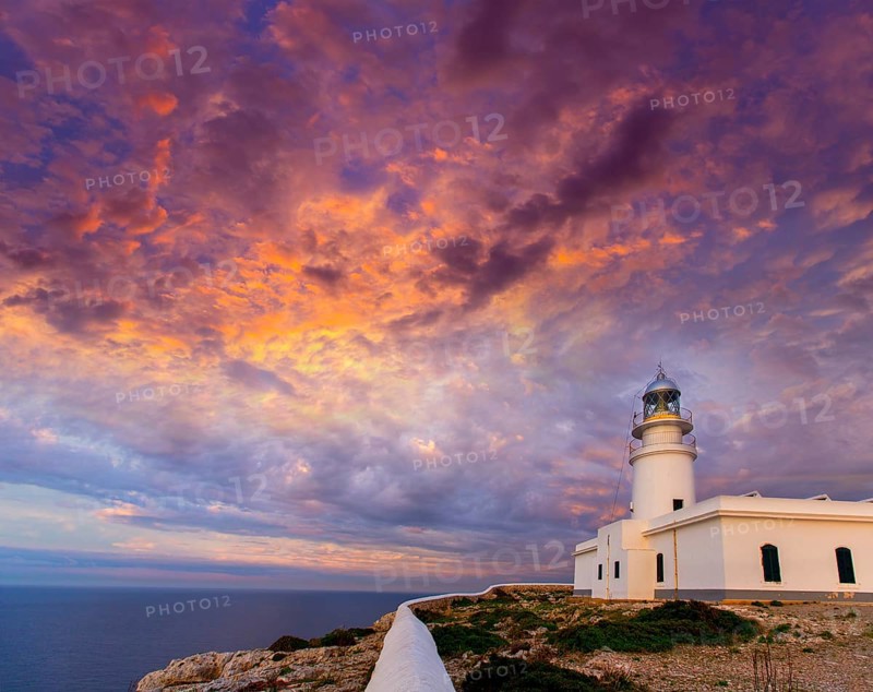 Menorca sunset in Faro Far de Caballeria Lighthouse at Balearic Islands es Mercadal