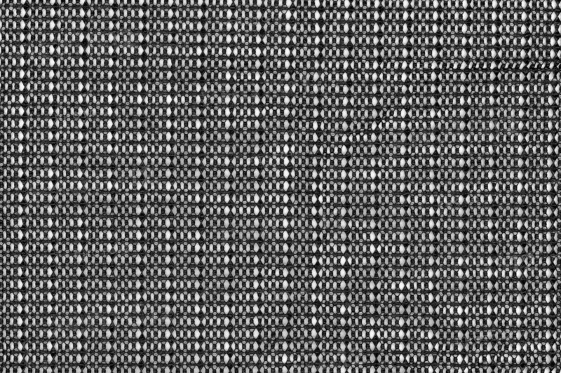 Black plastic fabric texture useful as a background
